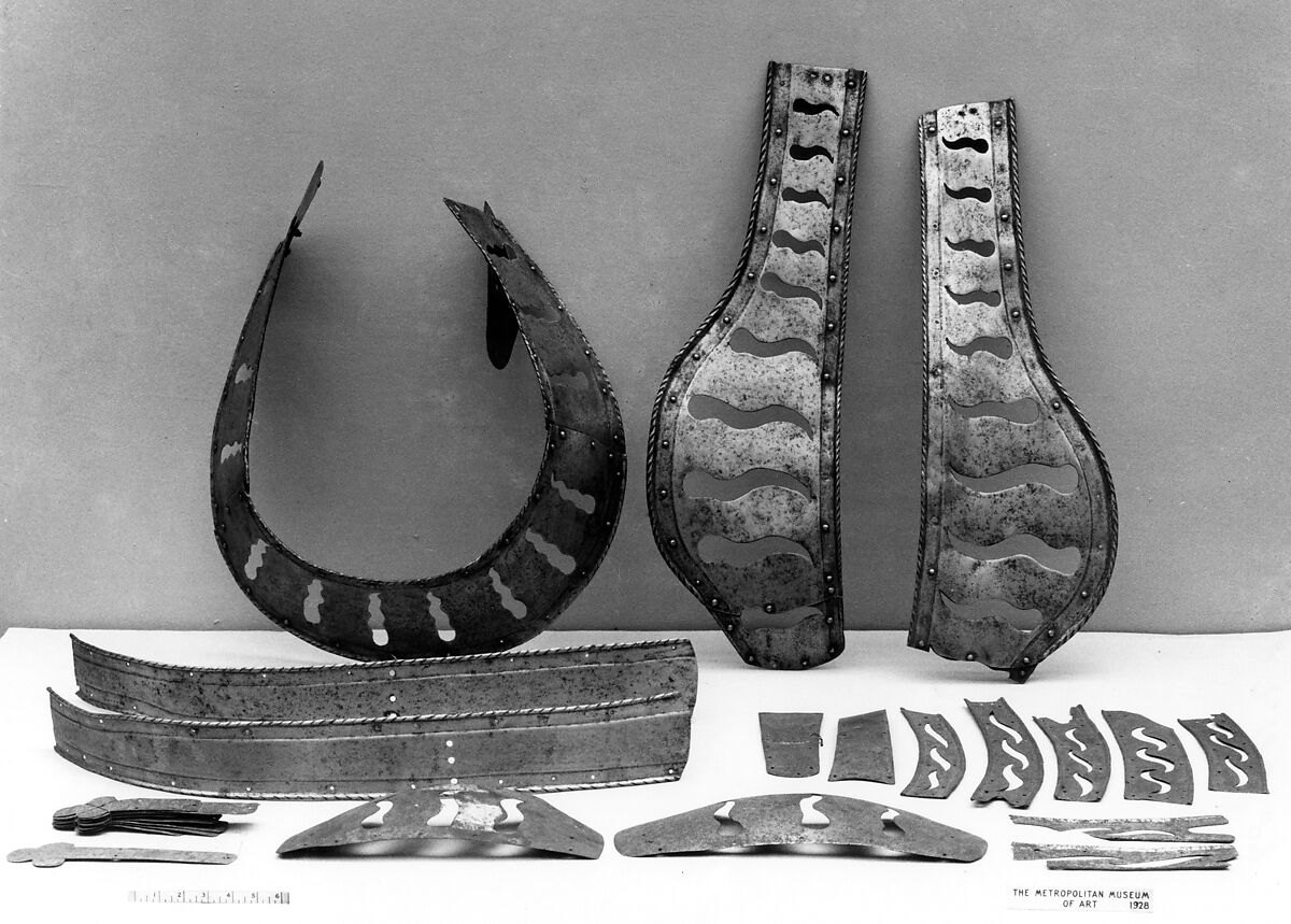 Components of sixteenth-century German steel horse armour arranged for museum study
